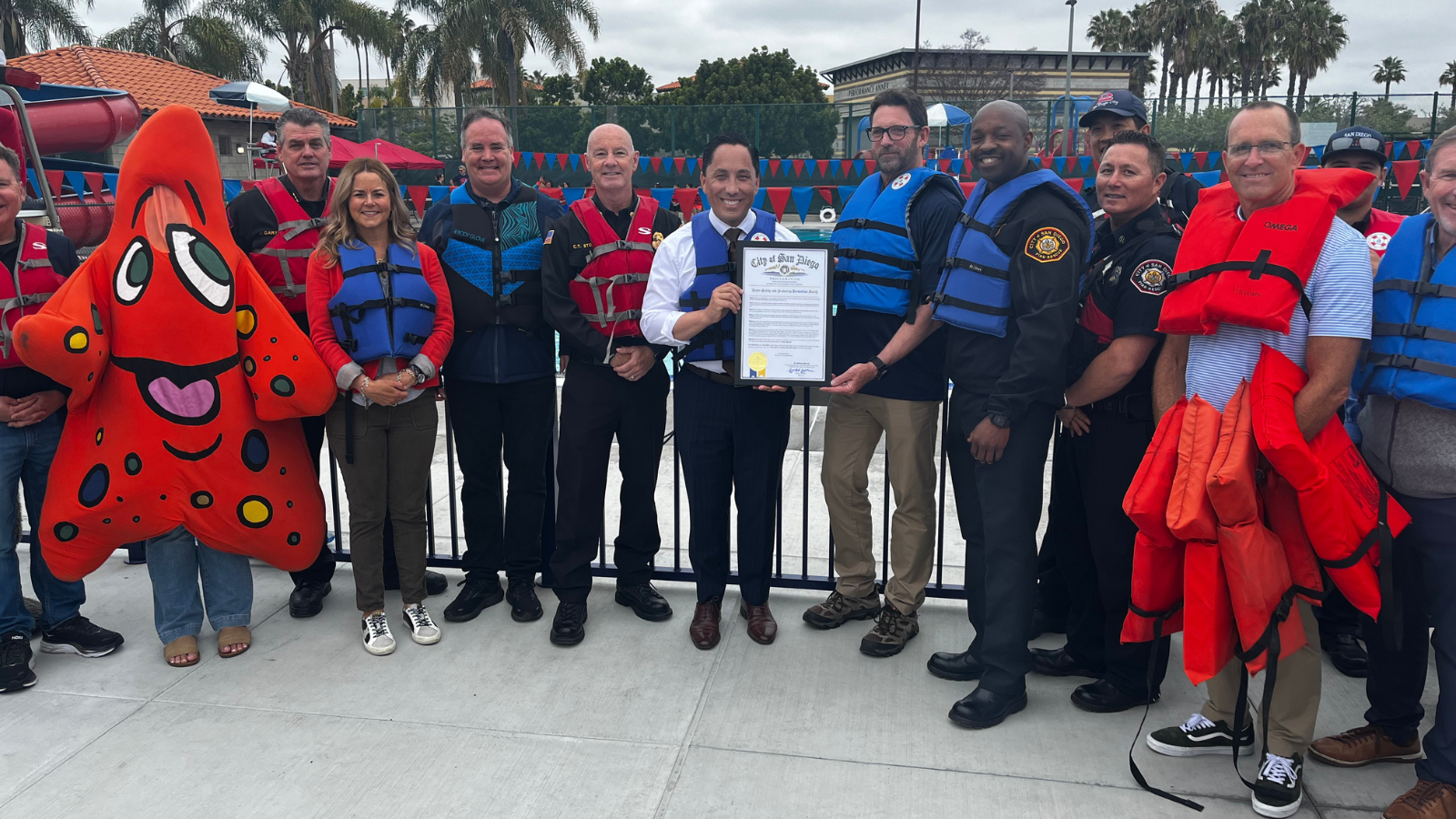 san diego leadership taking a group picture of the Water Safety Month proclamation 