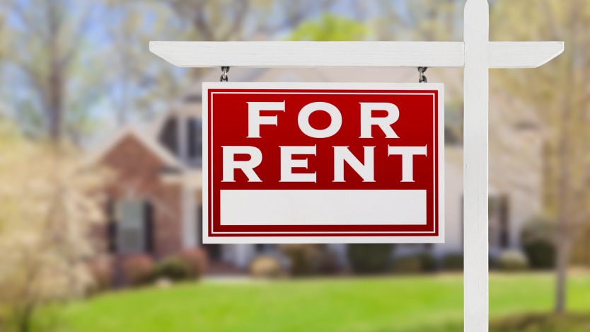 for rent sign posted in front of a house